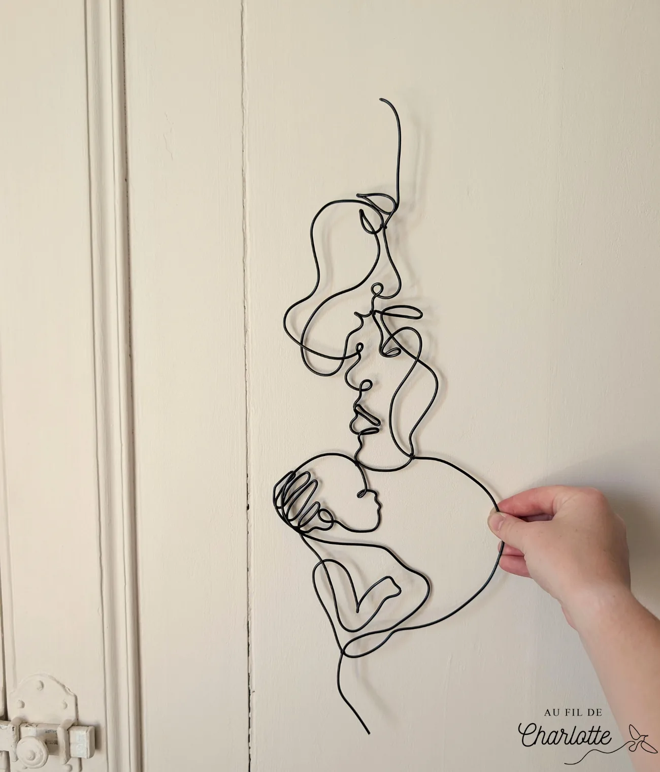 Couple avec bébé en fil de fer décoration murale